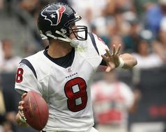 quarterback in american football on blurred background