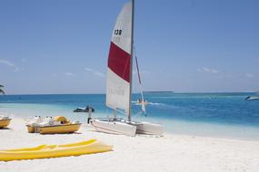 boats on white Beach, Maldives
