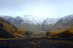 mountains with valleys under the blue sky