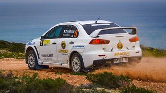 white racing car on the coast