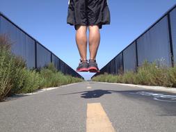 Jump Man Sports over road