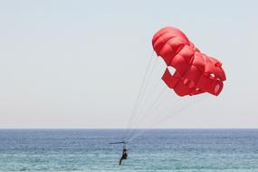 red parachute over water