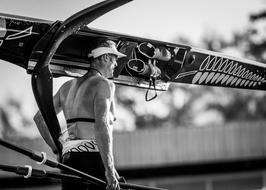 athlete with paddles in black and white background