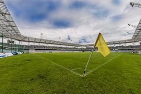 yellow flag in the corner of the football stadium