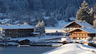 Beautiful houses, near the lake, among the trees, in snow, in Tegernsee, Germany