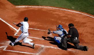 Baseball players and umpire, on the game