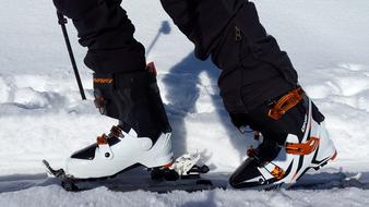 macro photo of ski boots on human feet