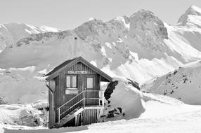 wooden toilet on a snowy peak in the alps, haute-savoie, france