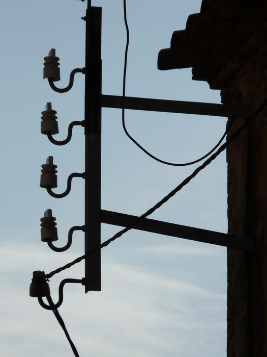 photo of power line insulators on the facade of the building