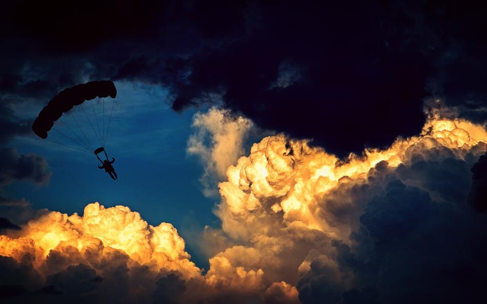 soaring paraglider in sky