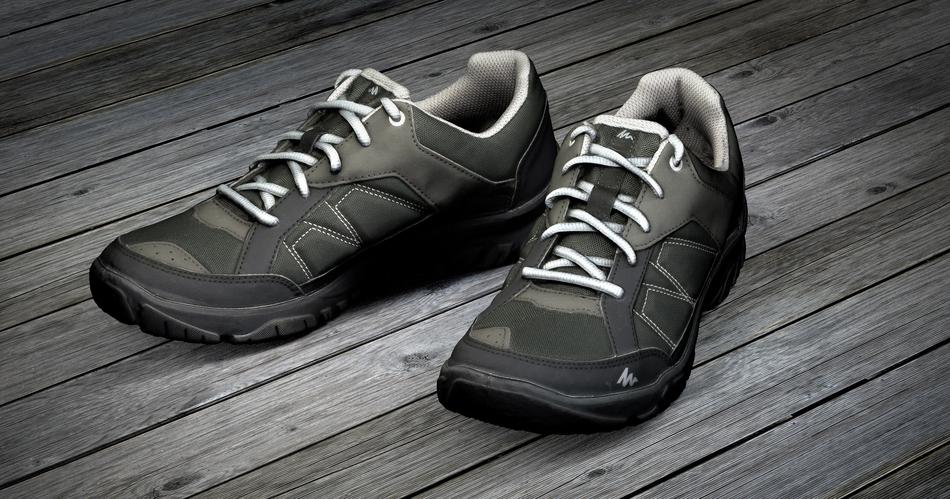 3d model of the green and black shoes, on the wooden surface