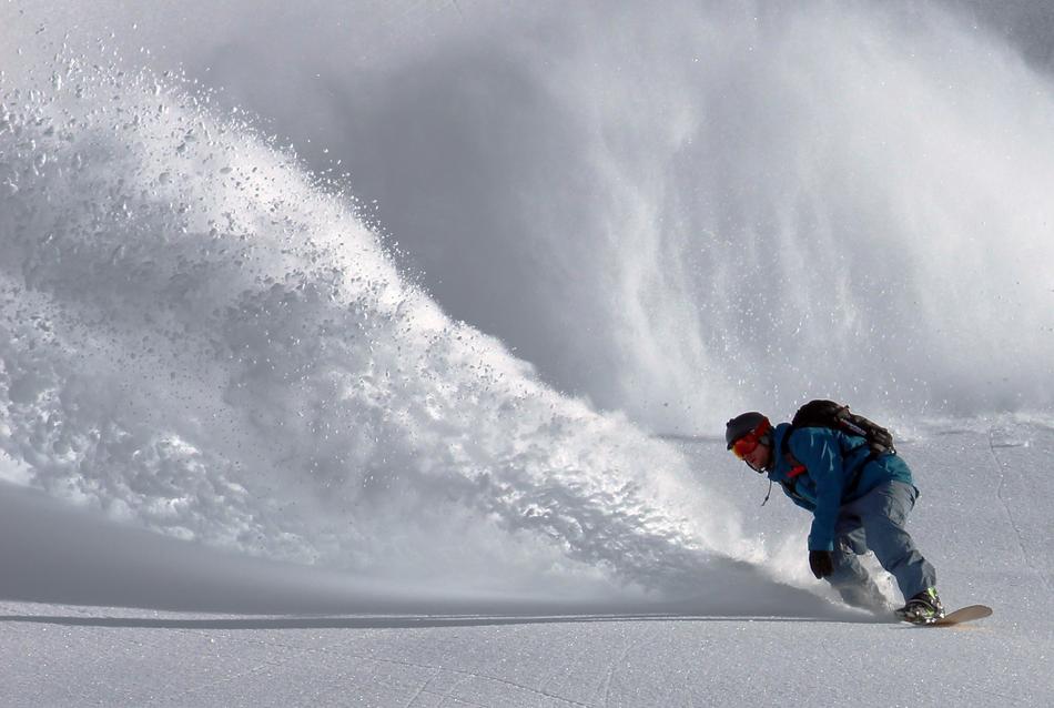 extreme snowboarding on an avalanche