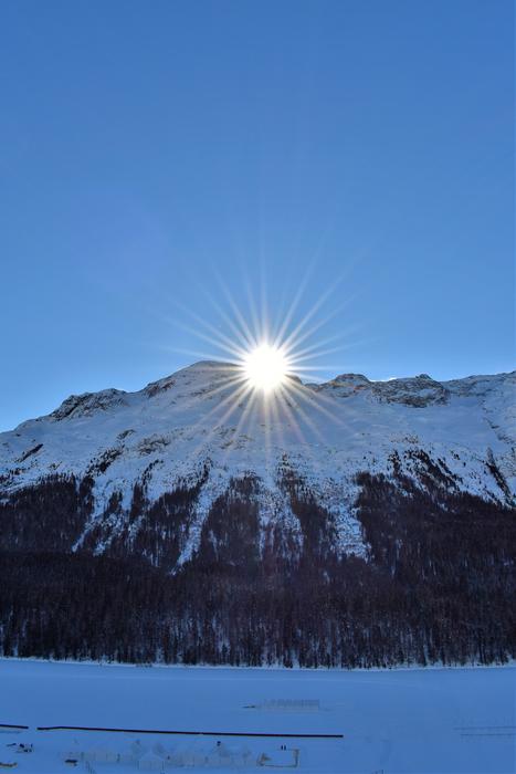 sun in the winter mountains