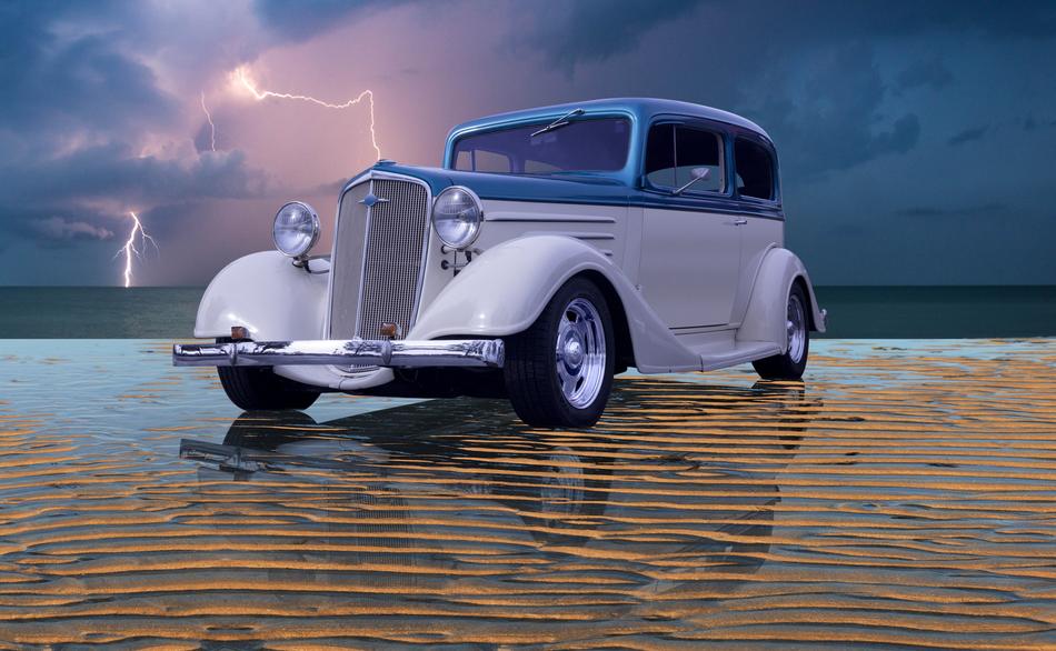 vintage sedan car on wet Beach and Lightning bolts at stormy sky, collage