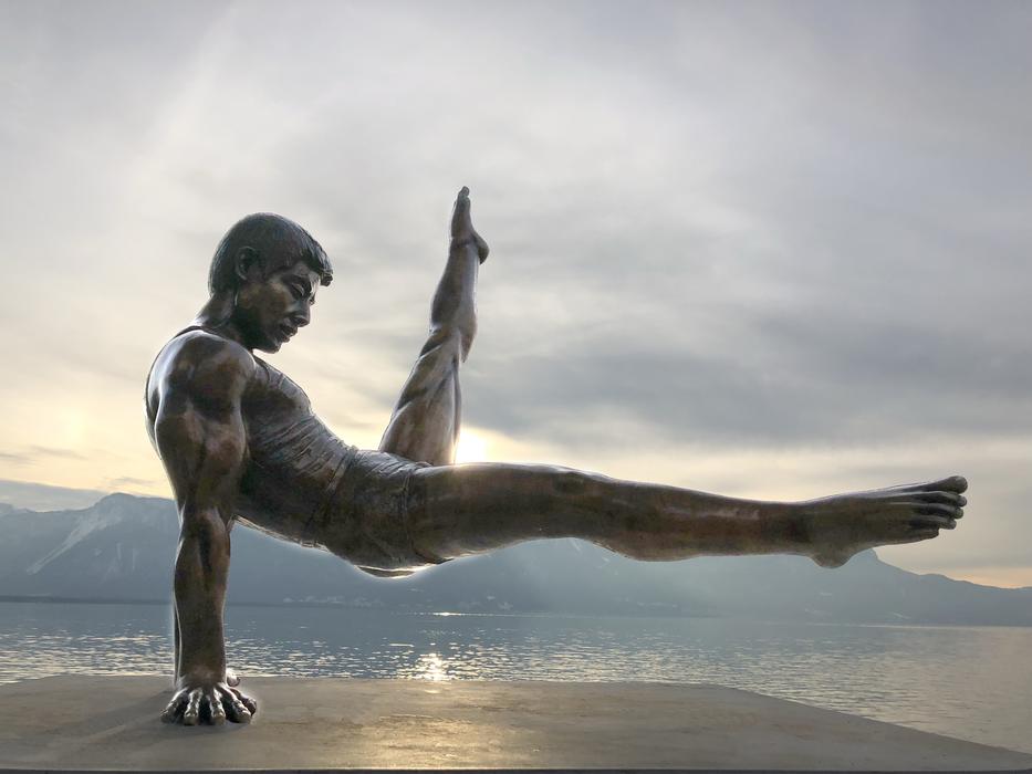 Beautiful, shiny statue of gymnast, on the shore in Montreux, Switzerland