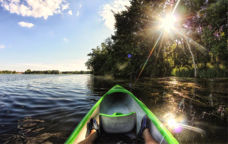 photo of the front of the canoe on the lake under the sun
