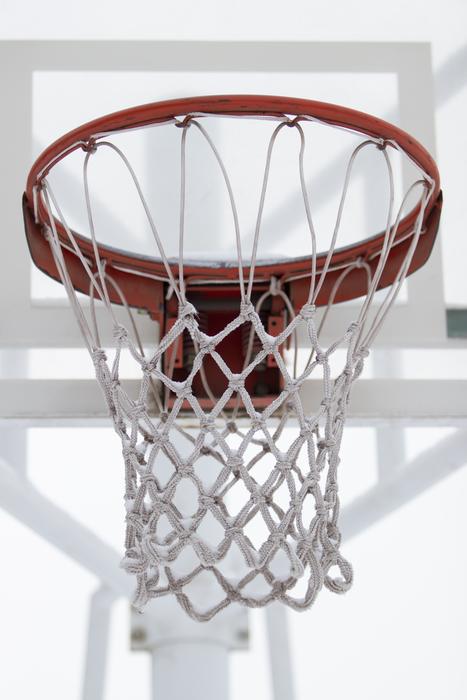 Red and white basketball hoop, on the white stand