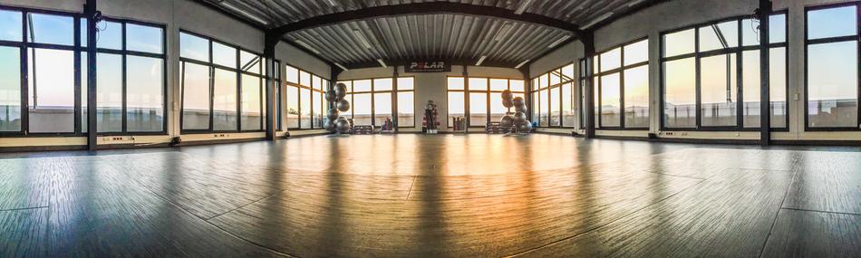 empty fitnesses studio with the big windows
