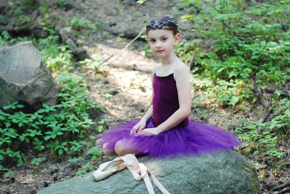 little ballerina in purple among nature