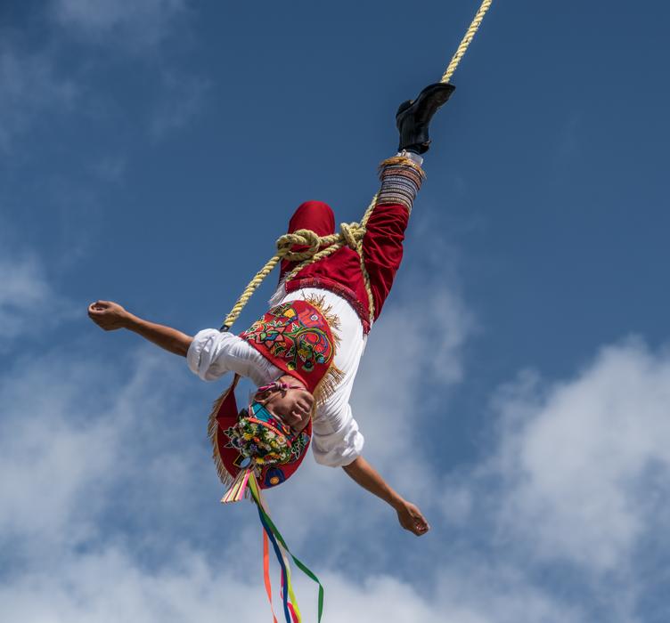 acrobat flying upside down in Mexico