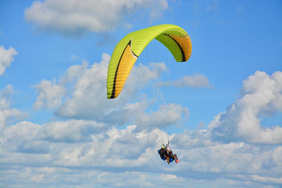 Paraglider at scenic clouds