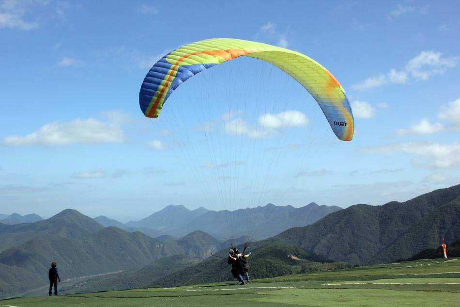 paragliding people in mountains, danyang