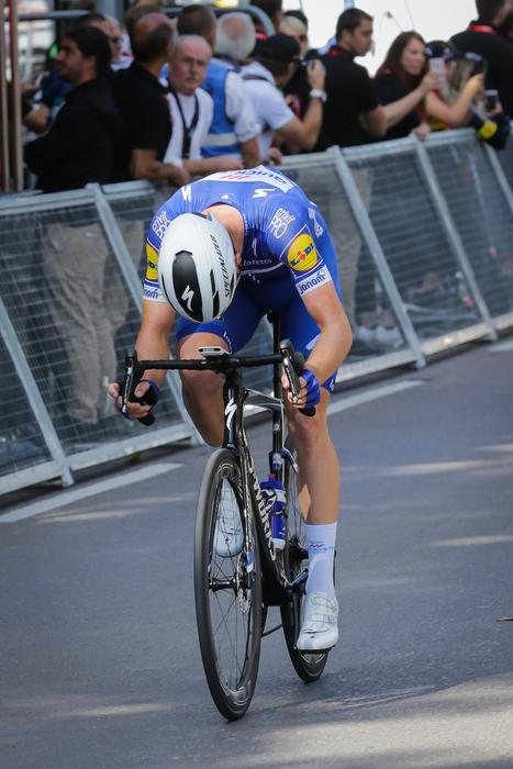 tired cycling racer at the finish