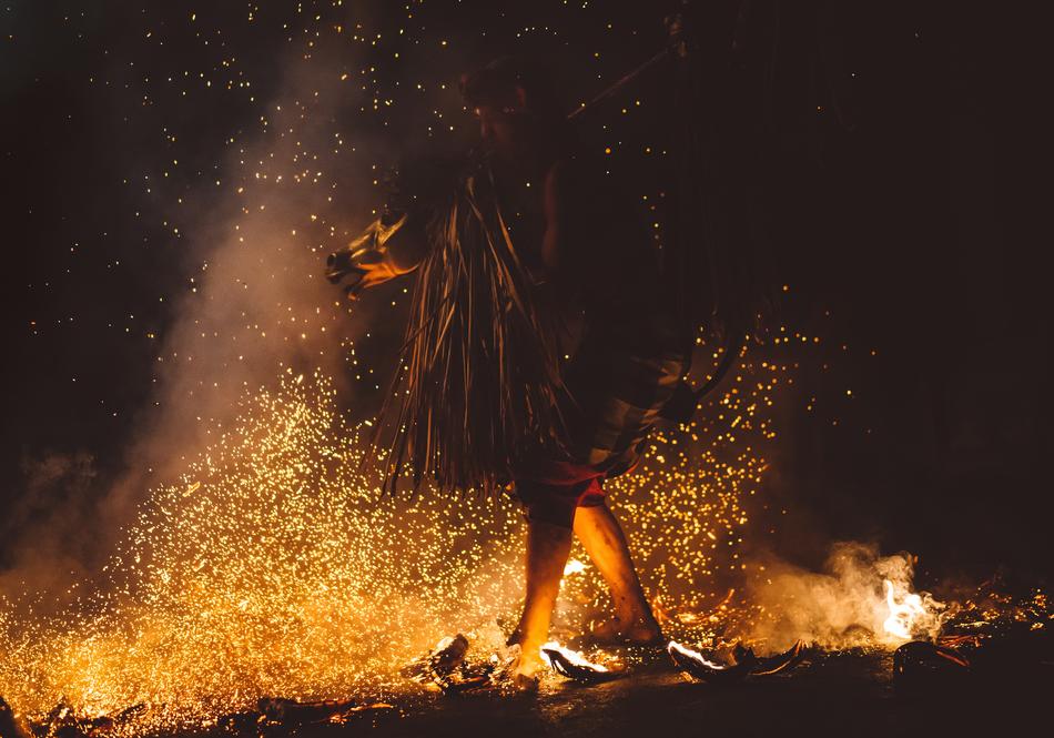 man and fire at dark
