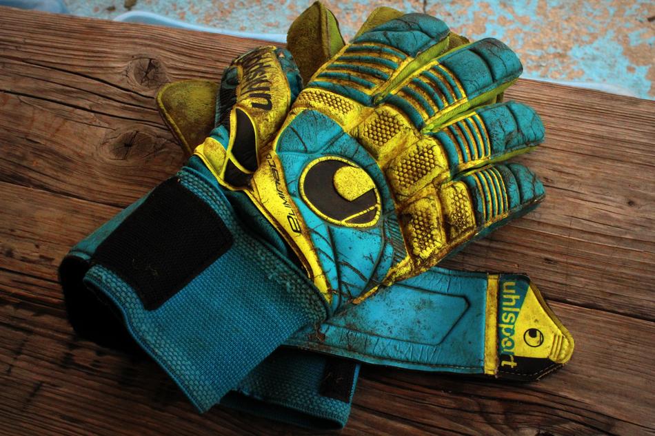 Bright goalkeeper's dirty gloves