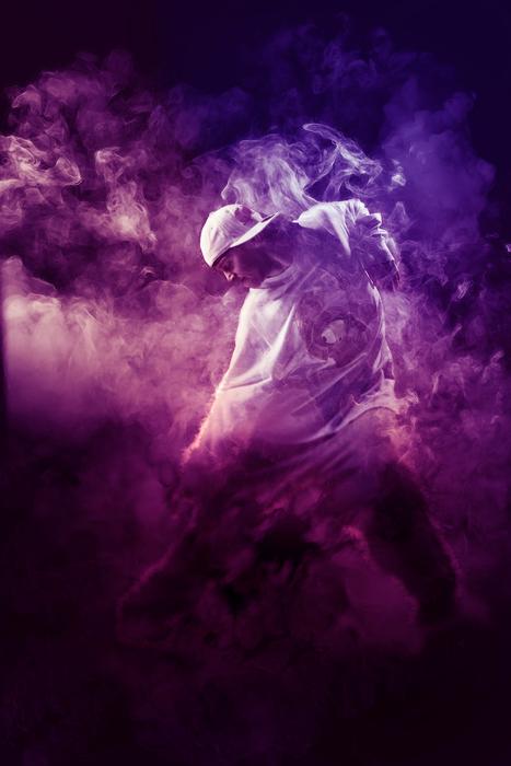 hip hop dancer in purple smoke