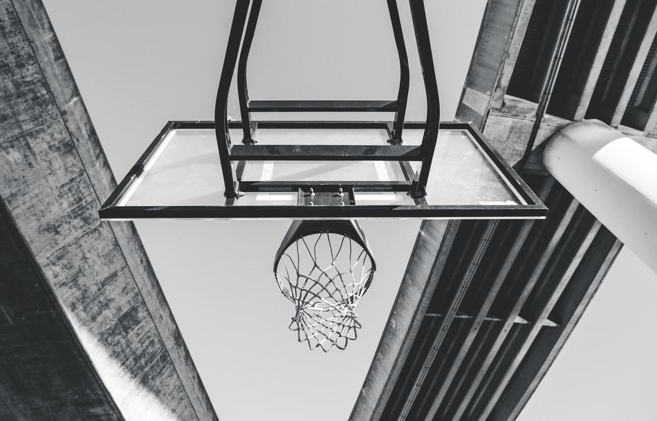 basketball hoop among concrete architecture