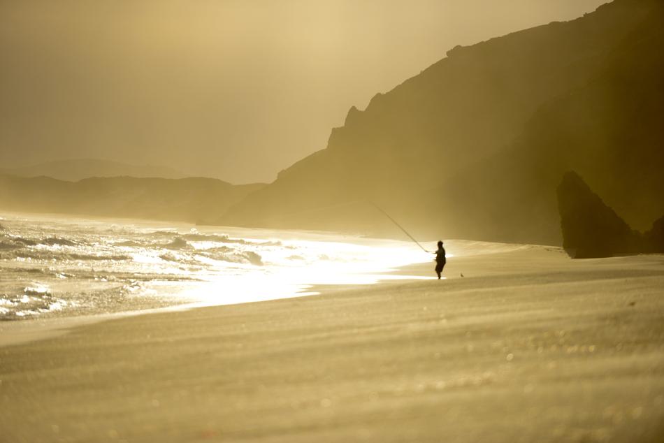 fisherman on the golden beach