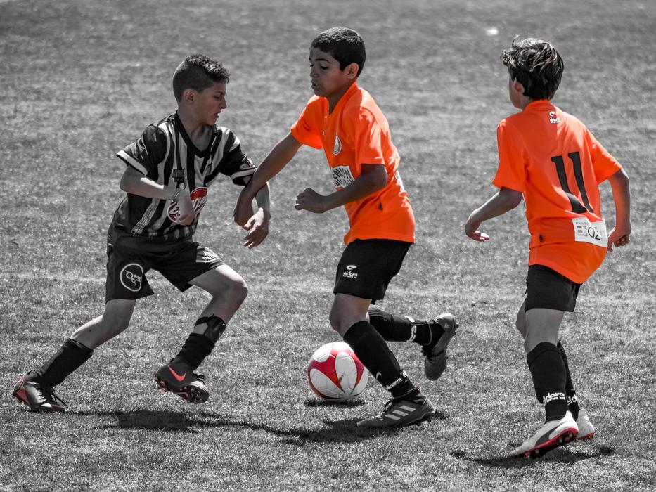 squad of small athletes in the stadium