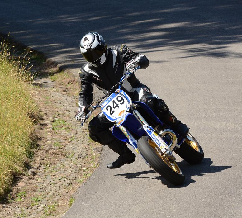 Man, riding on the motorbike, on the competition on the road, on the competition