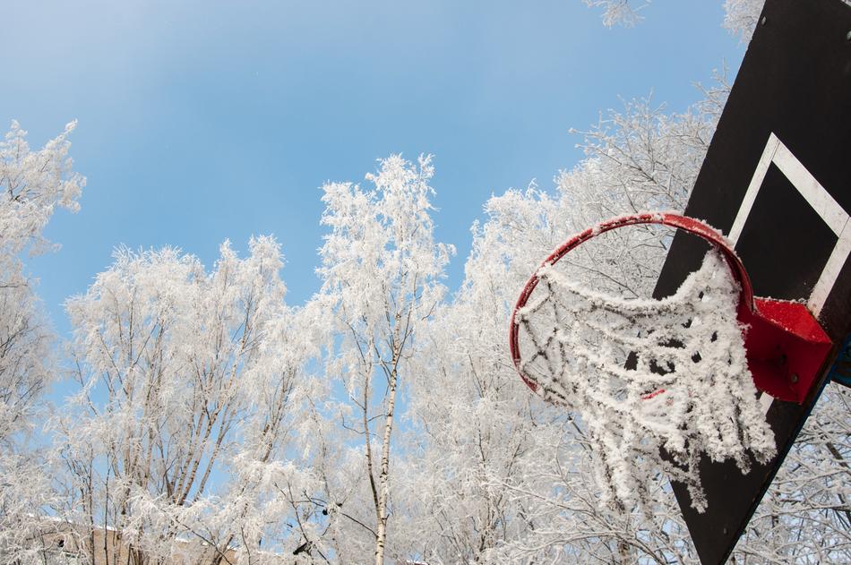 snow and icicles on a basketball hoop