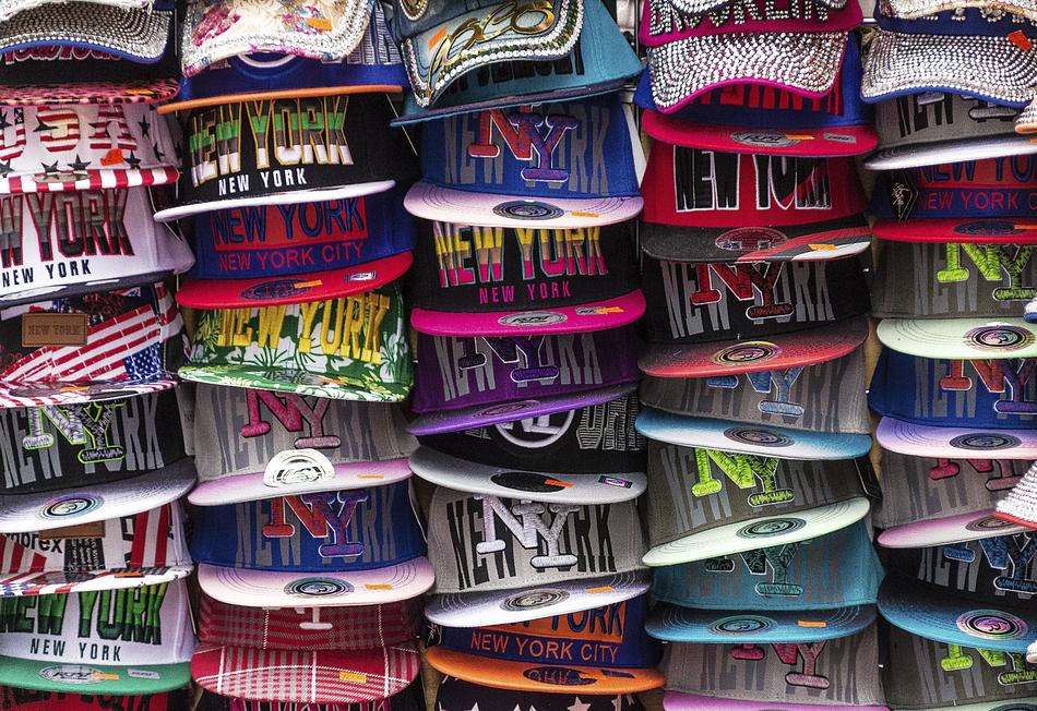 multi-colored baseball caps in the market