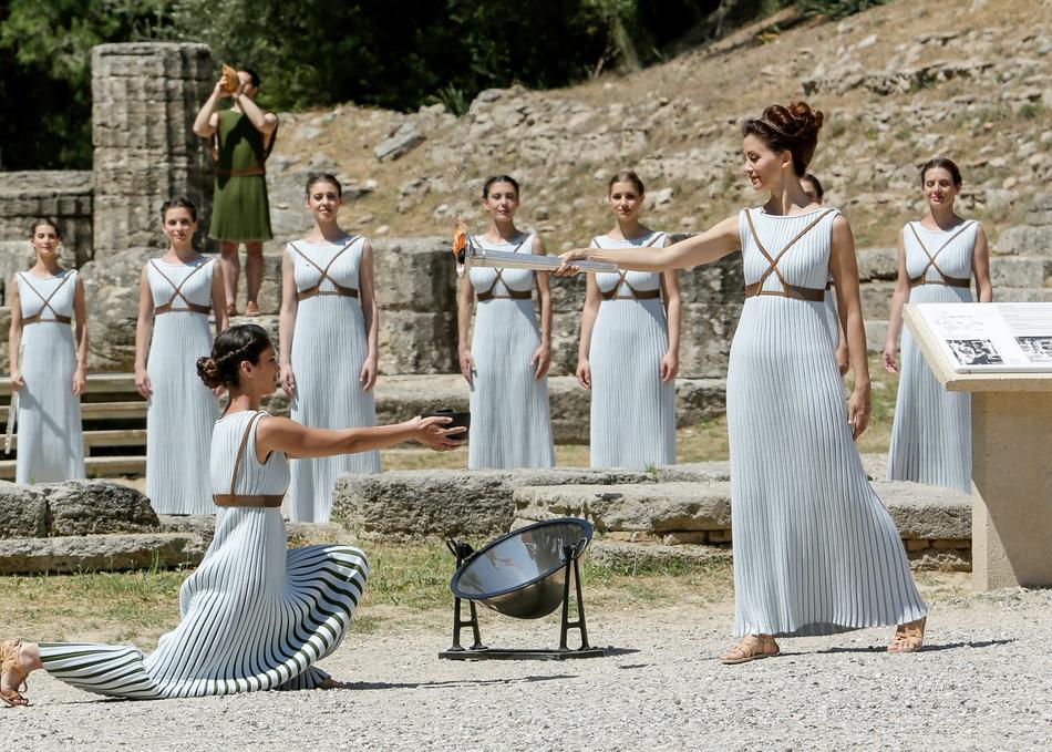 Women in white clothing, dancing among the amphitheatre