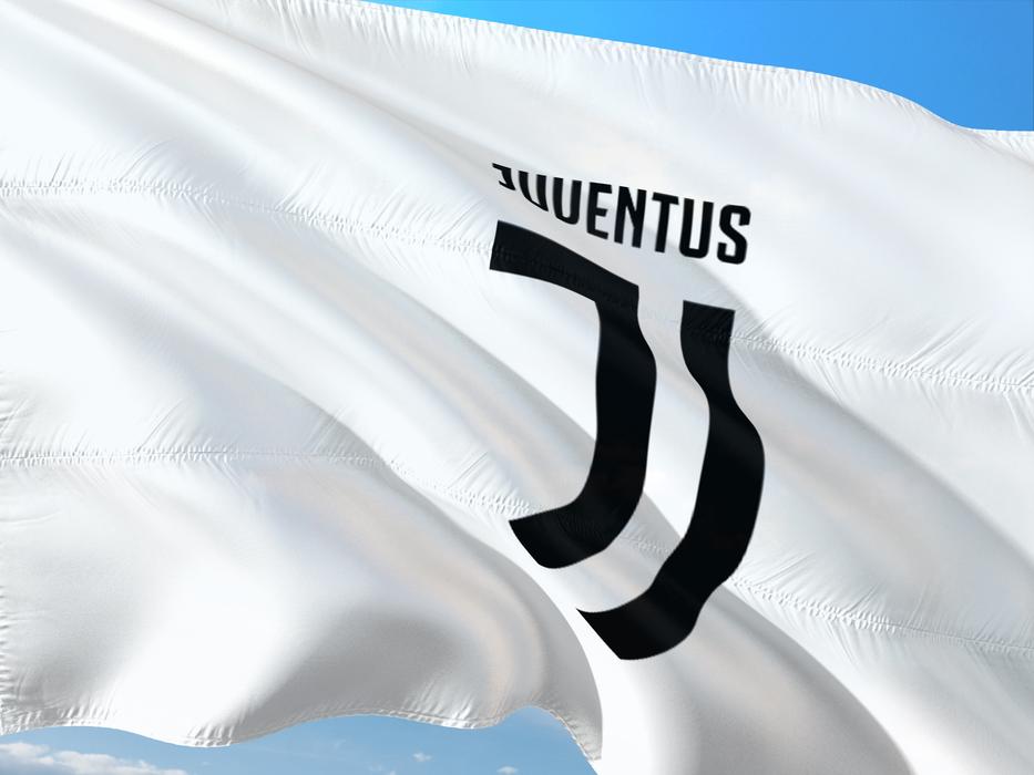 white flag of juventus team at sky