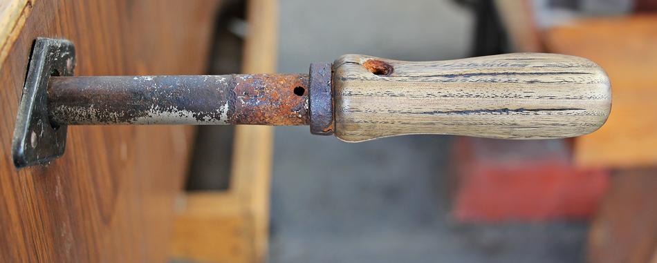 wooden handle on foosball on blurred background