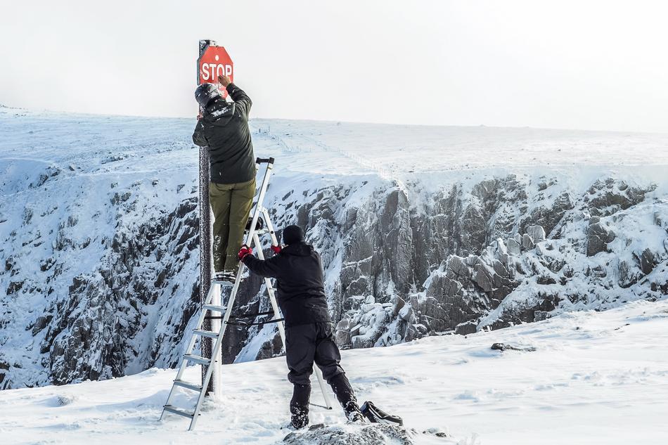 danger sign in the snowy mountains