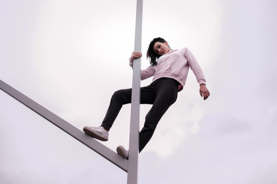 Girl, posing on the metal construction