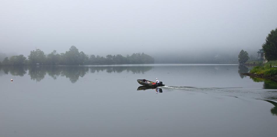 canoe on the river in the fog