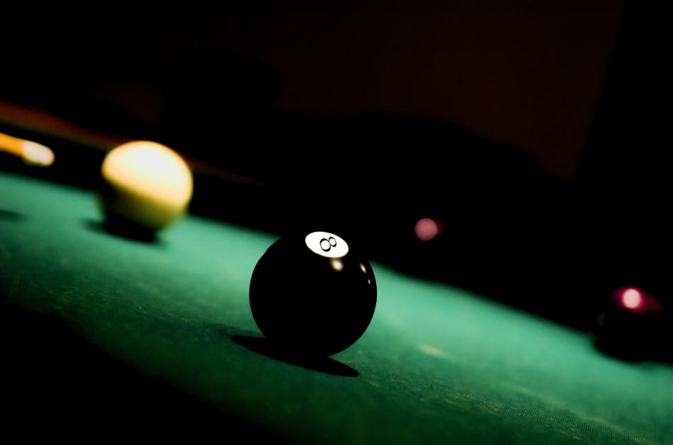 black and white billiard balls on the table