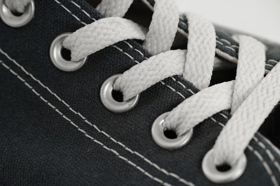 Black and white photo, with the close-up of the shoes, with the lacing