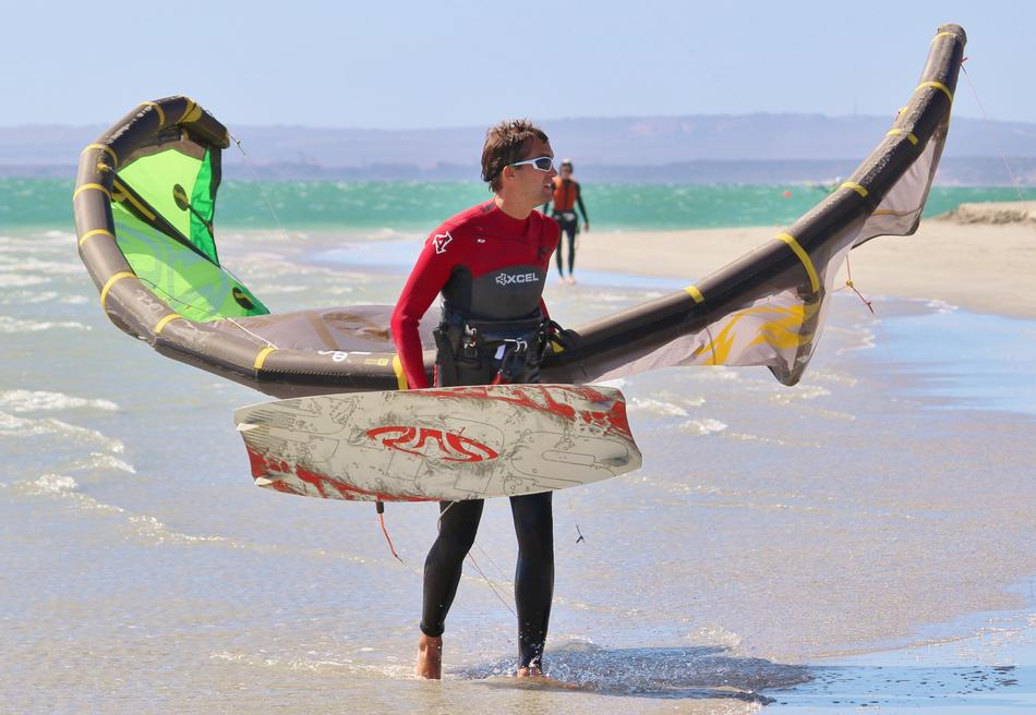 Kiting on the beach on a sunny day