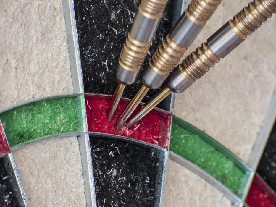 three Darts in target
