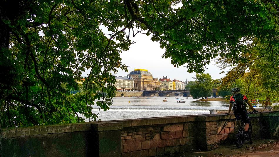 cyclist on the embankment of the Vltava river, Prague, Czech Republic