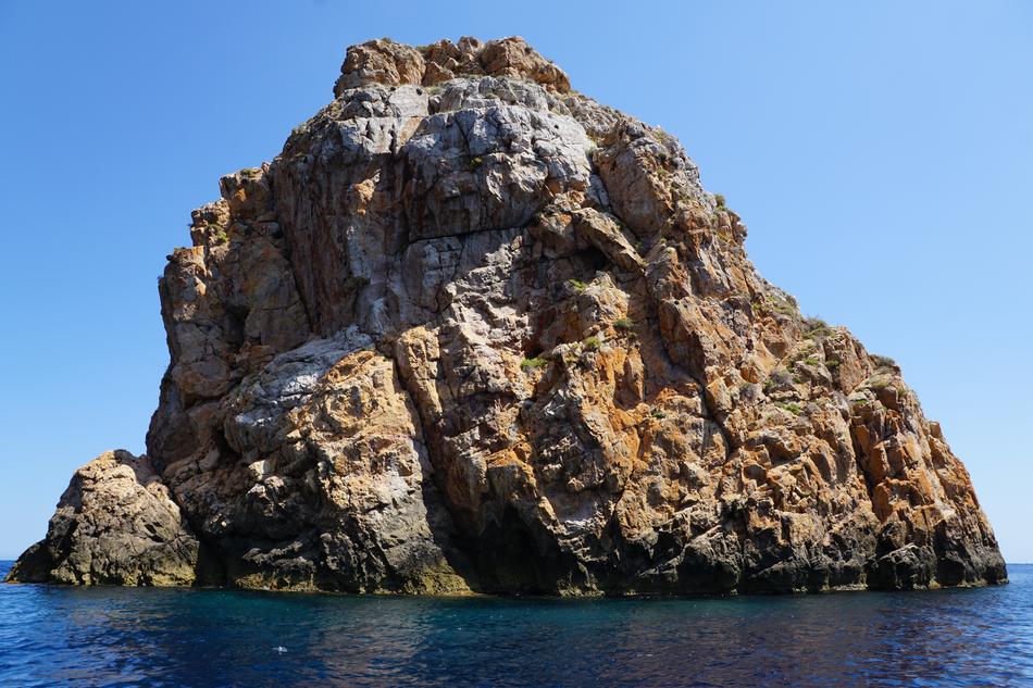large rocky island in the sea in spain