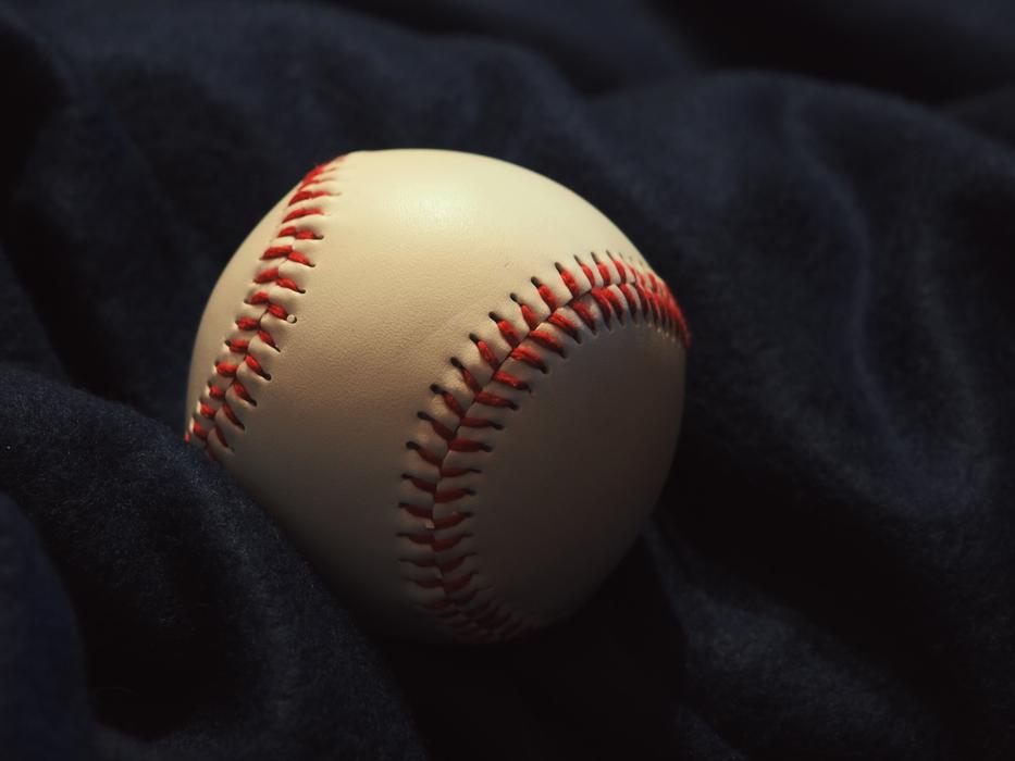 Ball Baseball on dark fabric close-up