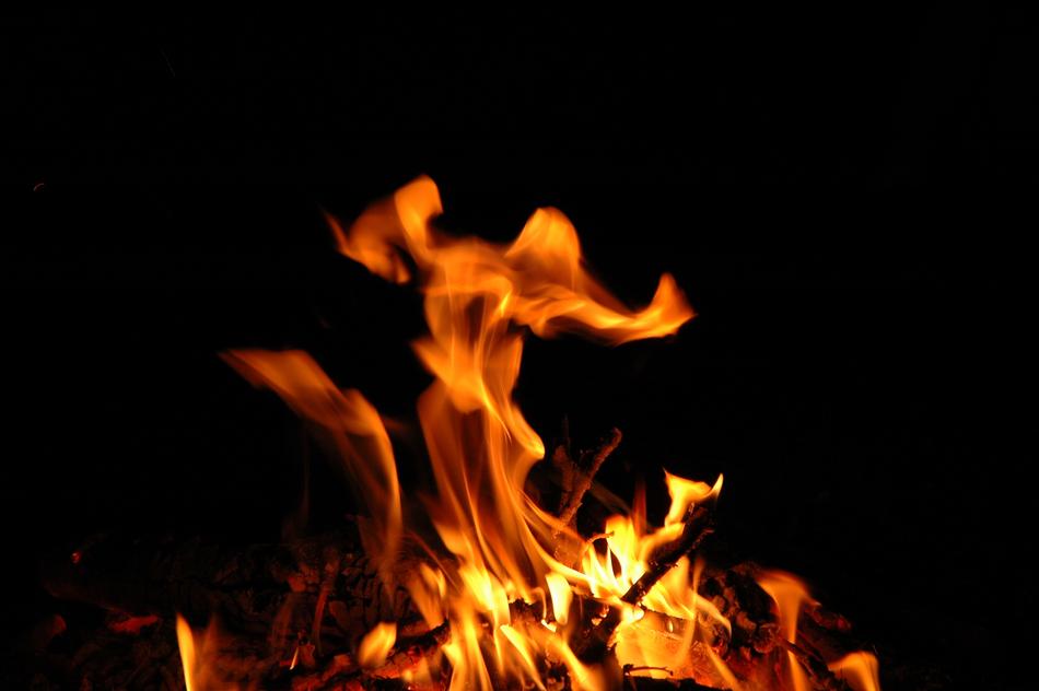 red flame on black background
